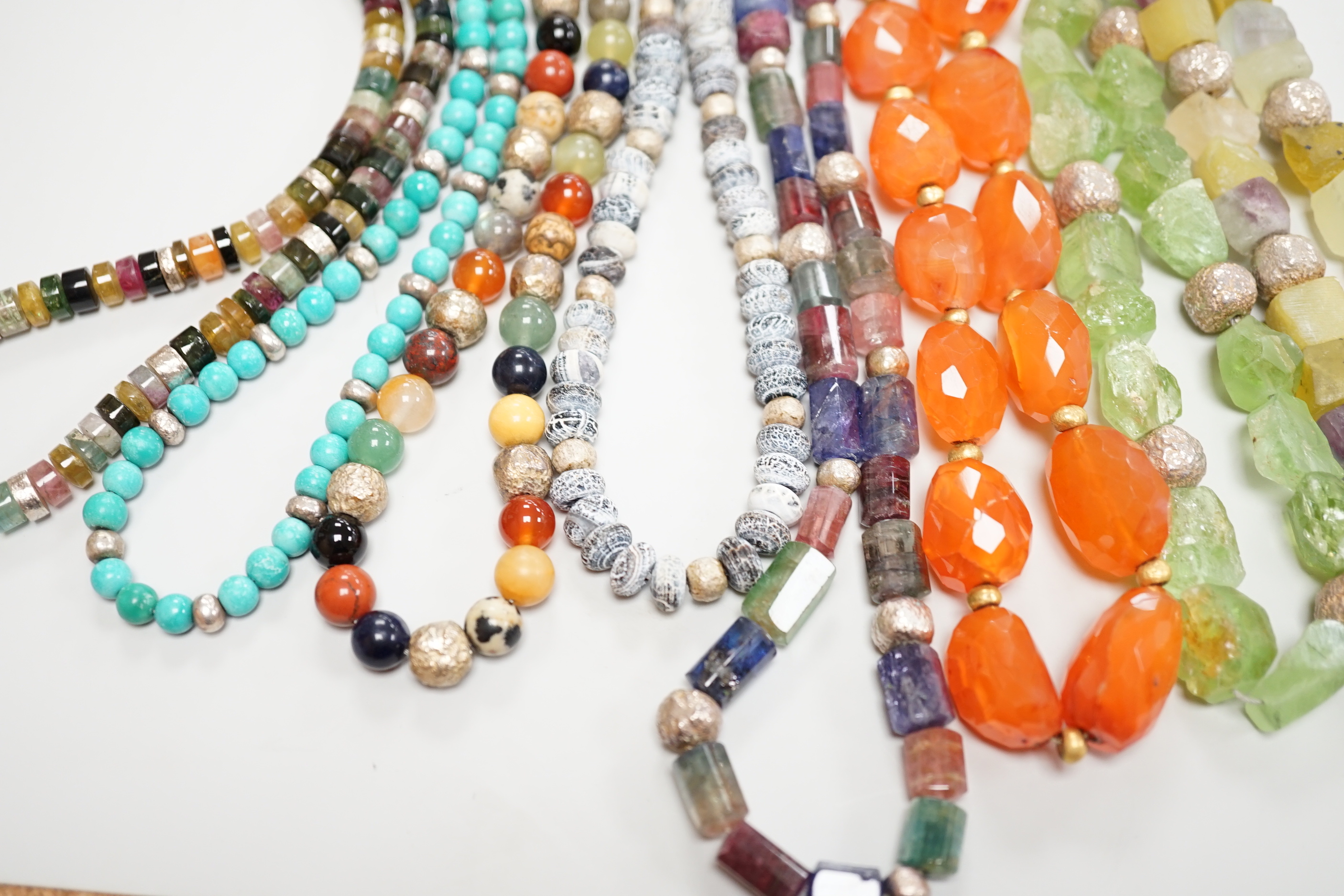 Five assorted Pruden & Smith silver and hardstone necklaces, largest 42cm and three other similar unsigned necklaces.